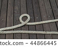 Ship rope on wooden plank floor. 44866445