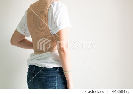 Woman wear back support belt in healthcare concept 44868452