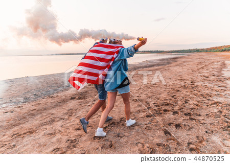 american couple with hand flare or fusee 44870525