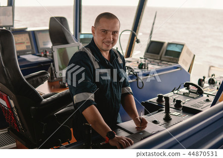 Marine navigational officer is using laptop or notebook at sea 44870531