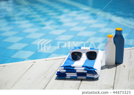 Summer holiday concept photo. vacation items and beach accessories in swimming pool or yellow background. 179 Summer holiday concept photo. vacation items and beach accessories in swimming pool or yellow background. 179 44873325