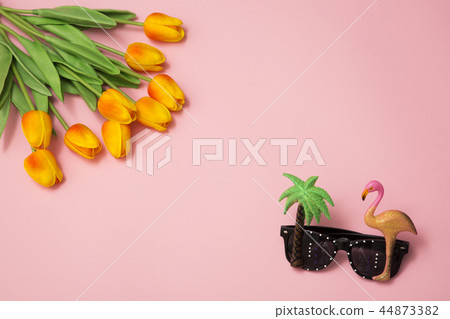 Summer holiday concept photo. vacation items and beach accessories in swimming pool or yellow background. 085 44873382