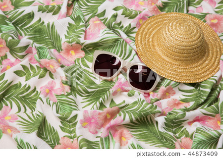 Summer holiday concept photo. vacation items and beach accessories in swimming pool or yellow background. 065 44873409