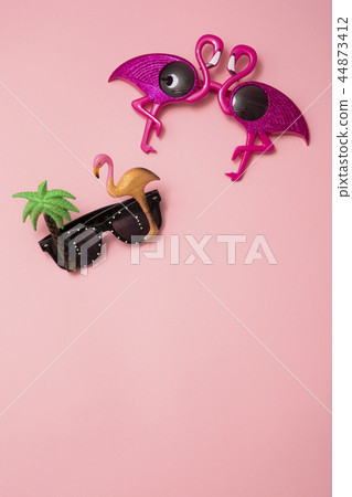 Summer holiday concept photo. vacation items and beach accessories in swimming pool or yellow background. 084 44873412