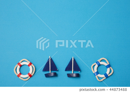 Summer holiday concept photo. vacation items and beach accessories in swimming pool or yellow background. 044 44873488