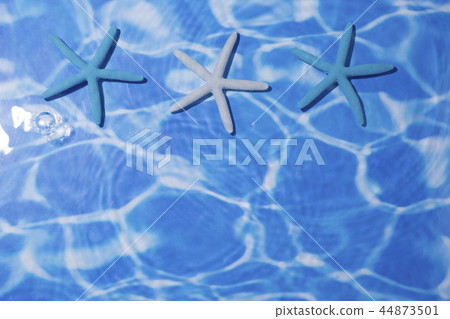 Summer holiday concept photo. vacation items and beach accessories in swimming pool or yellow background. 012 44873501