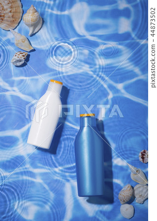 Summer holiday concept photo. vacation items and beach accessories in swimming pool or yellow background. 009 44873502