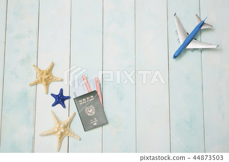 Summer holiday concept photo. vacation items and beach accessories in swimming pool or yellow background. 062 44873503