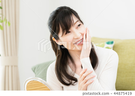 Woman to check skin condition Woman to check skin condition 44875419