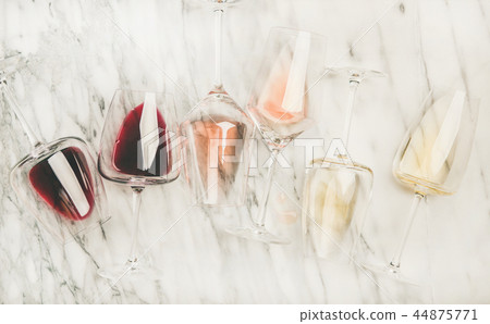 Red, rose, white wine in glasses and corkscrews Red, rose, white wine in glasses and corkscrews 44875771