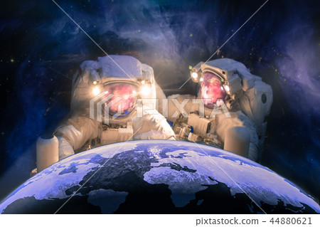 Two huge astronauts repait the planet Earth Two huge astronauts repait the planet Earth 44880621