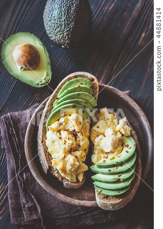 Sandwiches with avocado and scrambled eggs Sandwiches with avocado and scrambled eggs 44881414