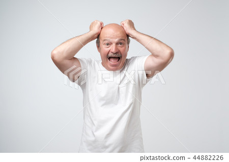 man feels shock and surprise 44882226