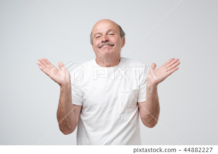 Puzzled bald caucasian man is not sure  44882227