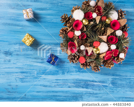 Chistmas door decoration with small gift boxes on blue wooden background Chistmas door decoration with small gift boxes on blue wooden background 44883840