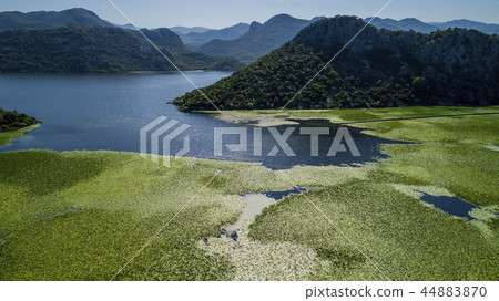 Aerial view of the beautiful landscape of Lake Skadar in the mountain on a sunny day. Montenegro Aerial view of the beautiful landscape of Lake Skadar in the mountain on a sunny day. Montenegro 44883870