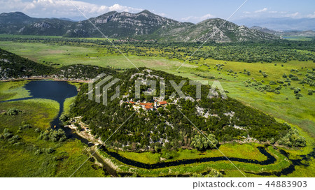 Aerial view of the landscape of Lake Skadar in the mountain and the island with monastery on a 44883903