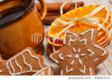 Fresh gingerbread, cup of coffee and spices Fresh gingerbread, cup of coffee and spices 44885559