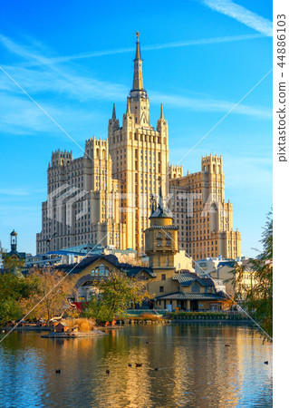 view of the city pond and a high-rise building view of the city pond and a high-rise building 44886103