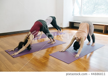 Young Japanese woman doing yoga lesson Downdog 44886811