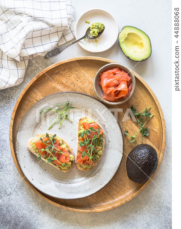 Toasts with avocado and salted salmon 44888068