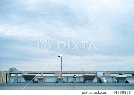 Industrial building rooftop with ventilation and metal pipes 44889538