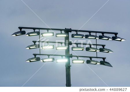 Airport landing lights against grey sky close Airport landing lights against grey sky close 44889627