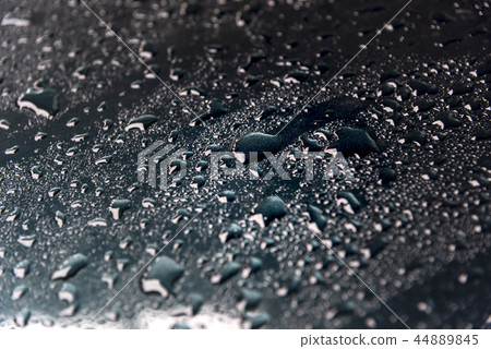 The rain drops on the floor and the light strikes. The rain drops on the floor and the light strikes. 44889845