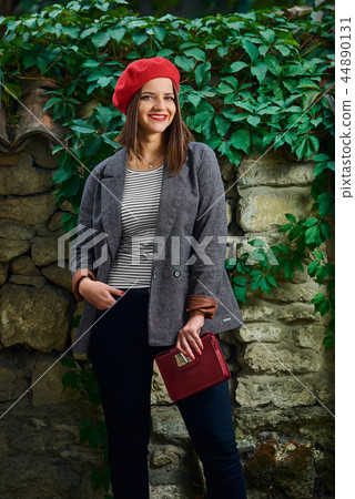 Smile with red handbag. 44890131