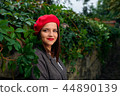 Thoughtful girl in red beret. 44890139