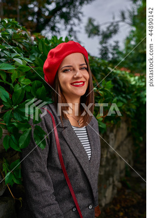Leaning on a fence. Leaning on a fence. 44890142