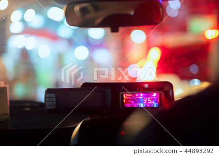 Night road view from inside taxi meter Night road view from inside taxi meter 44893292