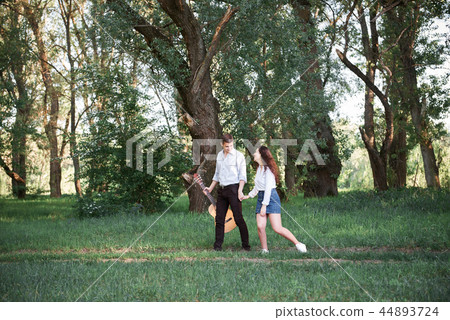 young couple walking in the forest and playing young couple walking in the forest and playing 44893724