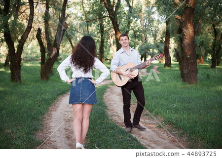 young couple walking in the forest and playing 44893725