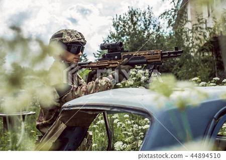 Military man with automatic rifle and rifle scope 44894510