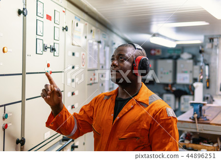 Marine engineer officer working in engine room Marine engineer officer working in engine room 44896251