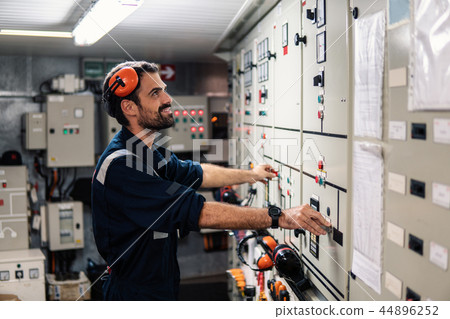 Marine engineer officer working in engine room Marine engineer officer working in engine room 44896252