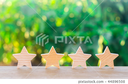 Four wooden stars. The concept of rating 44896508