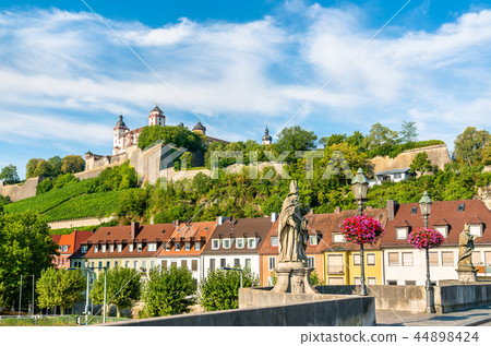 Statue on the Alte Mainbrucke and Marienberg Fortress in Wurzburg, Germany 44898424