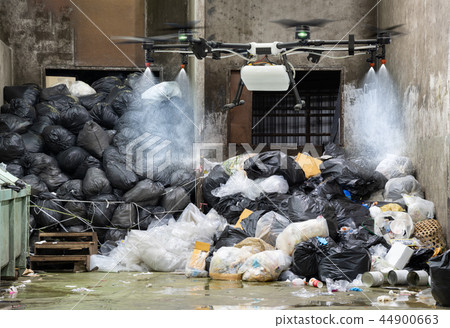 Drone flying spray disinfectants in garbage shed 44900663