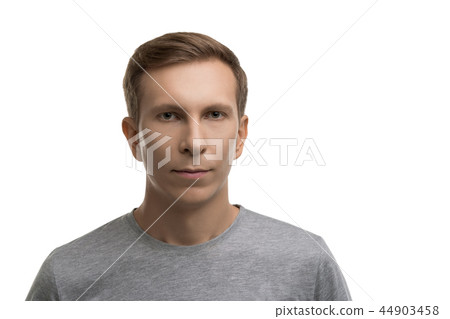 Resolute male in gray t-shirt isolated portrait Resolute male in gray t-shirt isolated portrait 44903458