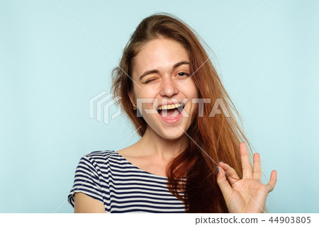 ok winking expression happy smiling joyful girl 44903805