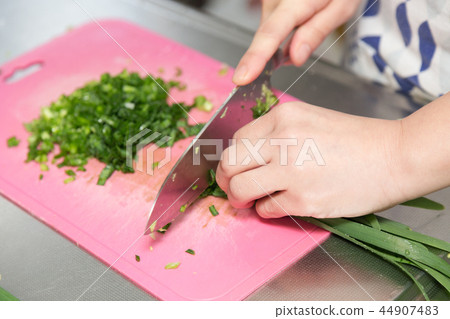 A woman who chops herring 44907483
