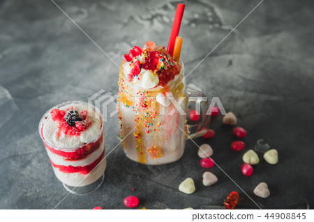 Pink unicorn milkshake with whipped cream 44908845