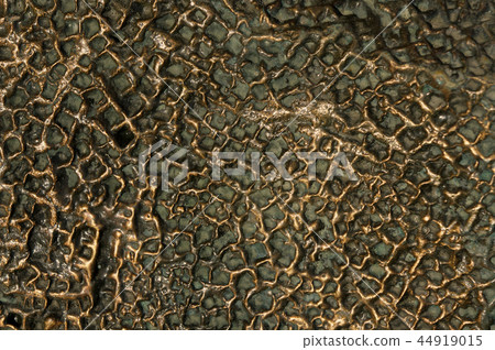Bronze metal texture. Uneven rough surface. 44919015