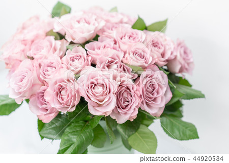 Roses lilac and pastel colors. Bright bouquet in metal bucket. concept of flower shop. 44920584