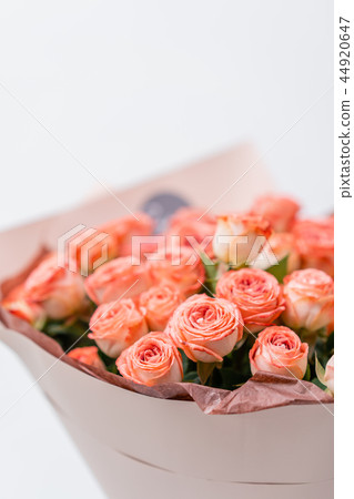 Roses peach and orange pastel colors. Bright bouquet in metal bucket. concept of flower shop. Roses peach and orange pastel colors. Bright bouquet in metal bucket. concept of flower shop. 44920647