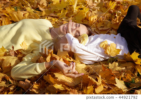 Happy family having fun in the autumn forest 44921792