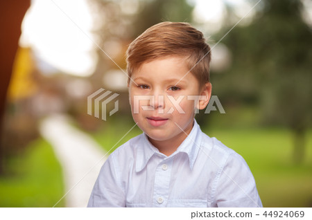 Cheerful cute little brown-eyed boy Cheerful cute little brown-eyed boy 44924069