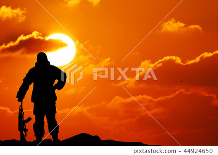 Silhouette shot of soldier holding gun Silhouette shot of soldier holding gun 44924650